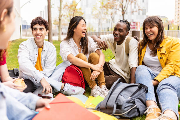 Group of college students laughing and smiling.